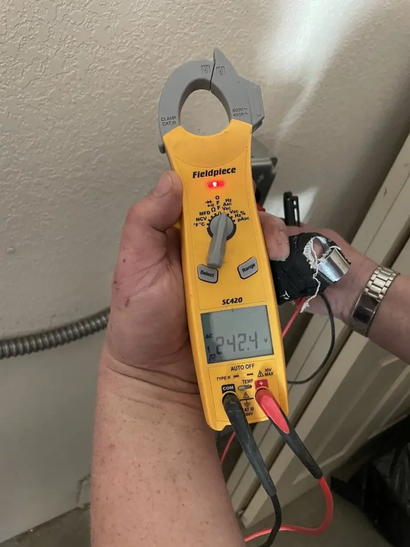 Voltage testing with clamp meter during Generator Installation in Okeechobee